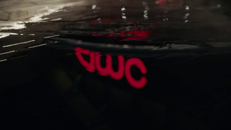 There's a puddle. The AMC logo is visible in the reflection, but wrong, inverted – a fascinating visual symbol for the state of the film industry during the twilight years of the pandemic.