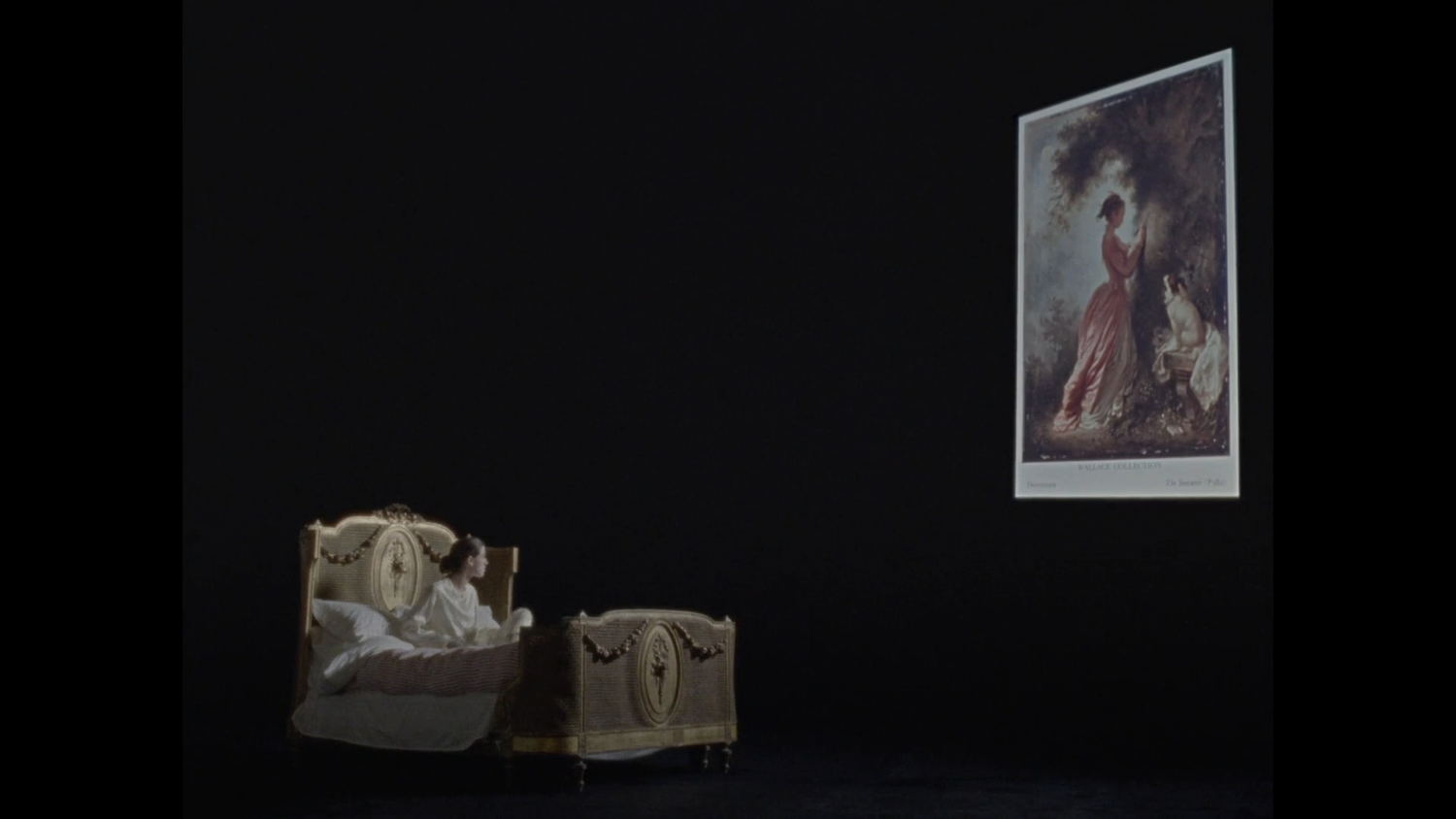 Woman in a luxurious bed in a dark space looking at an enormous painting in the distance