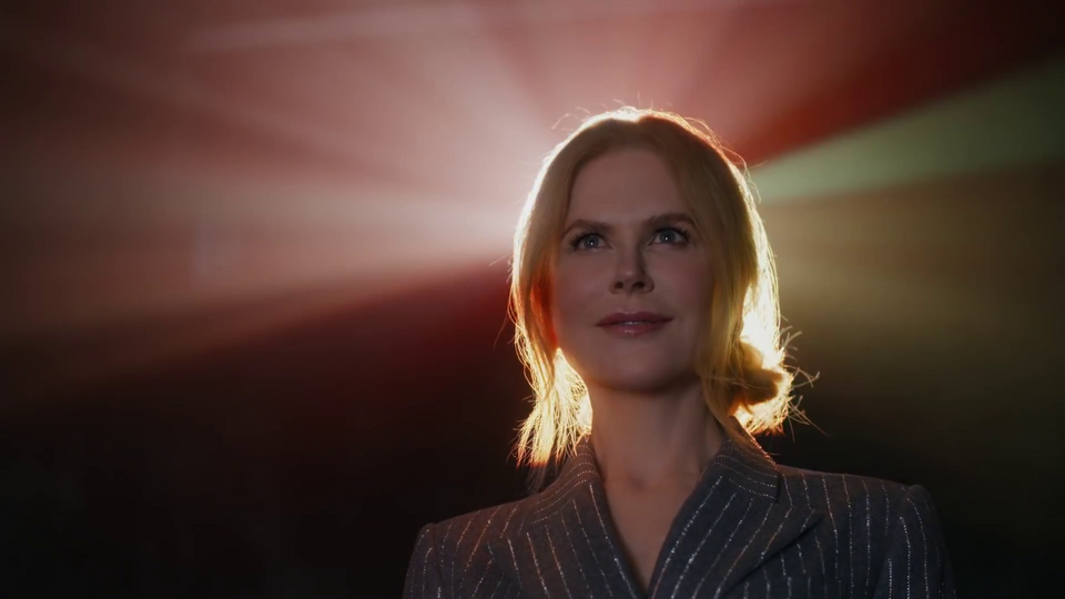 Nicole Kidman finds her seat. There are quick shots of different movies playing. The light from the projector dances around her face like a halo as she looks onward. The Angel of Cinema, the Savior of Theaters, has taken her rightful place.